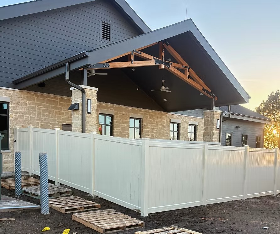 Commercial vinyl fence installation by Taylormade Fence LLC in Sarpy County, NE